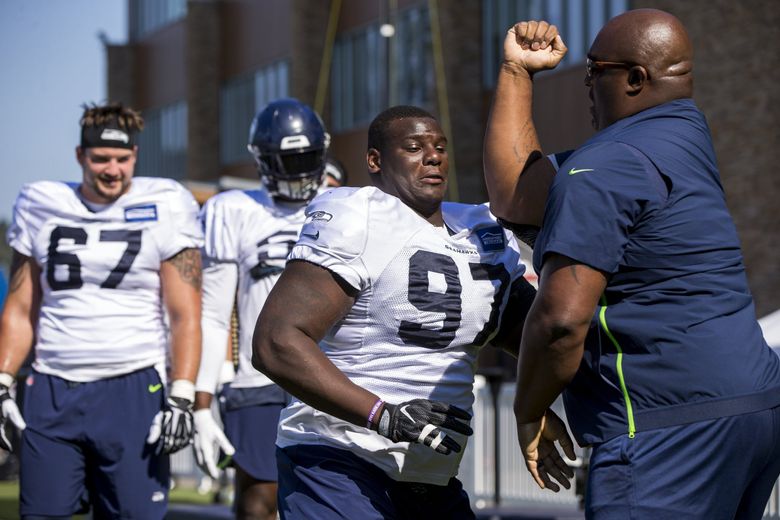 Seattle Seahawks defensive tackle Poona Ford runs through a drill