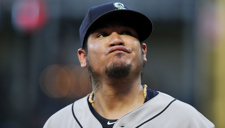 Seattle Mariners' Felix Hernandez walks to the dugout after the