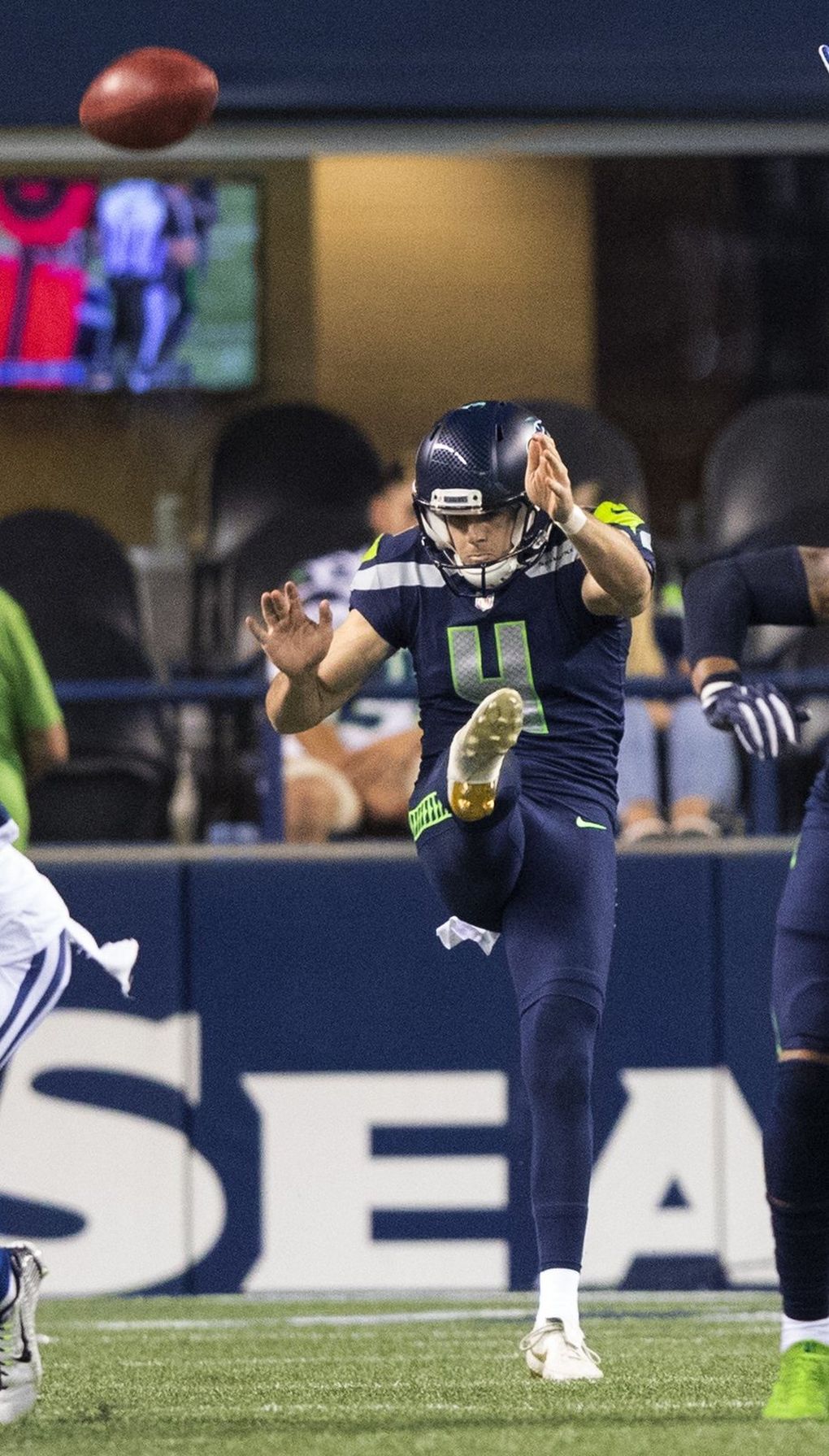 Seattle Seahawks punter Michael Dickson (4) punts during 4th quarter action as the Seattle Seahawks play the Indianapolis Colts on Thursday. (Mike Siegel / The Seattle Times)