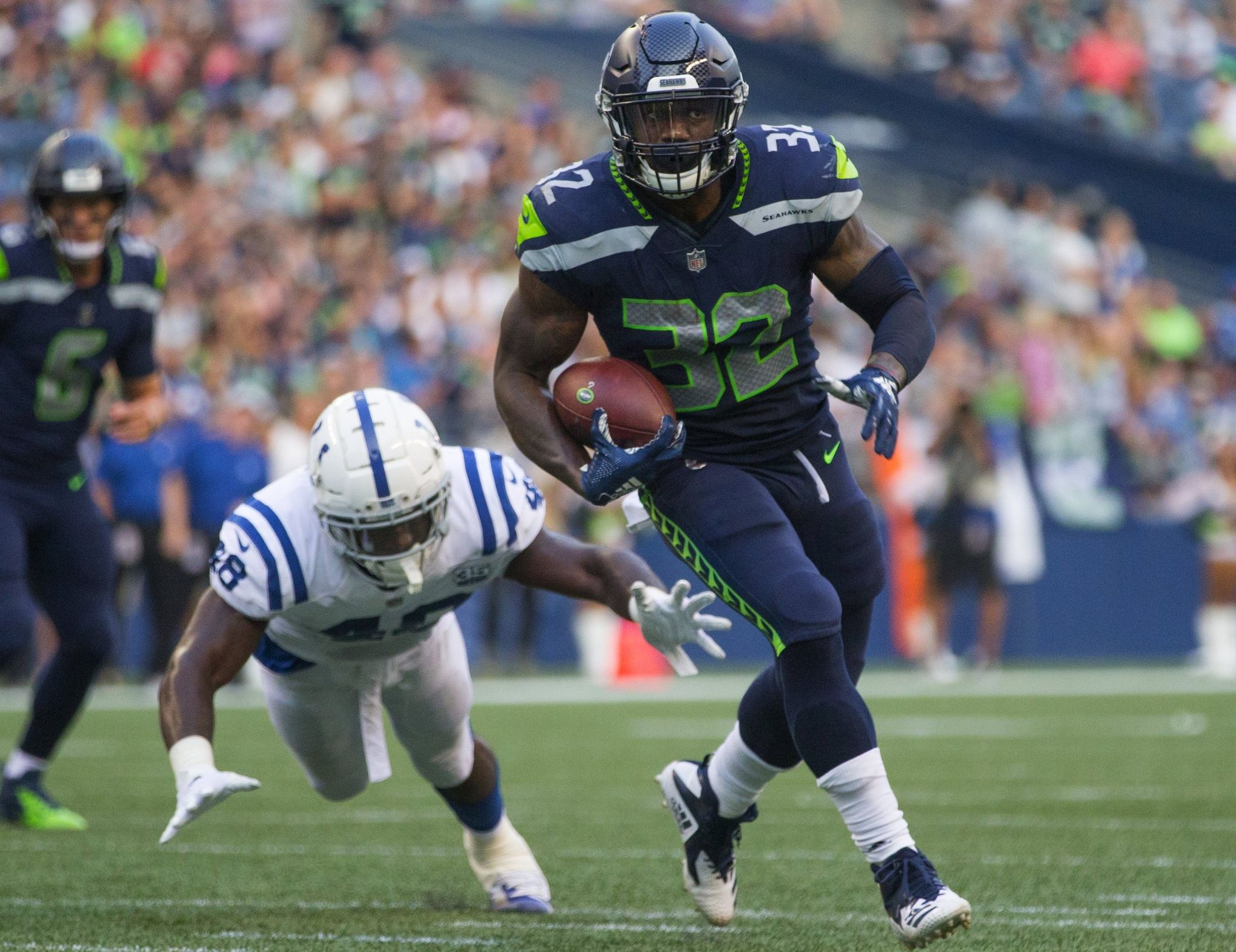 Seattle Seahawks running back Ricky Watters carries the ball