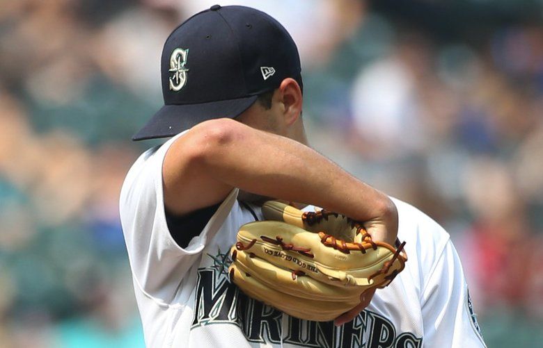 Mariners starting pitcher Marco Gonzales wipes away sweat in the disastrous fourth inning for the M’s, against the Astros, Wednesday Aug. 22, 2018, at Safeco Field in Seattle. 207418