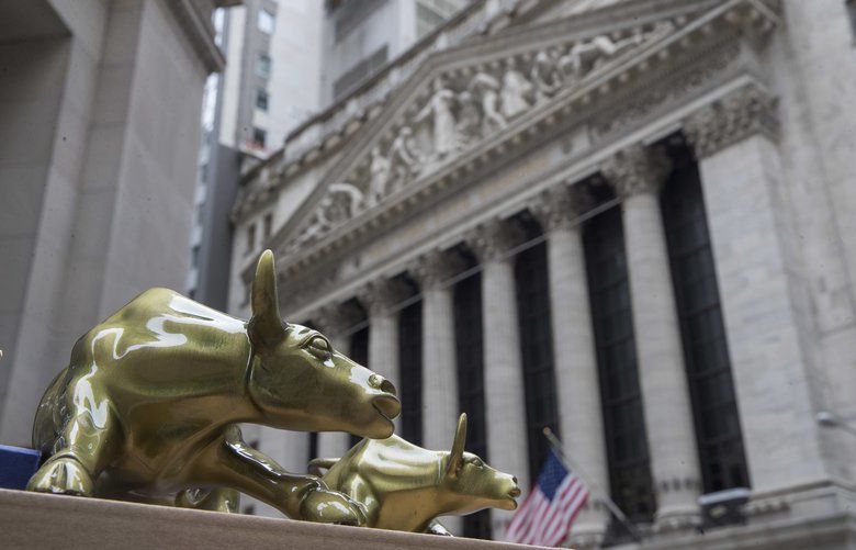 Wall Street  and the New York Stock Exchange in New York. Bulls (AP Photo/Mary Altaffer, File)
