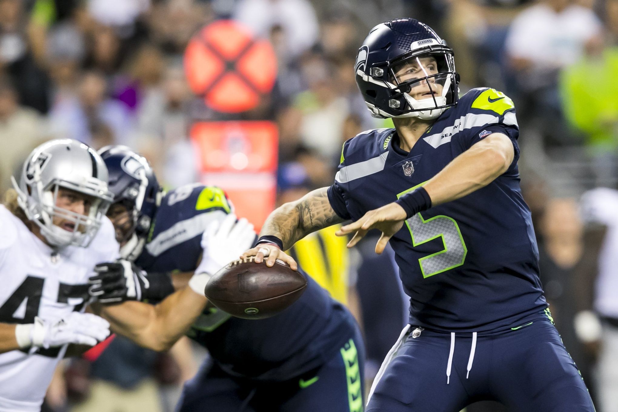 Seattle Seahawks quarterback Alex McGough (5) looks down field