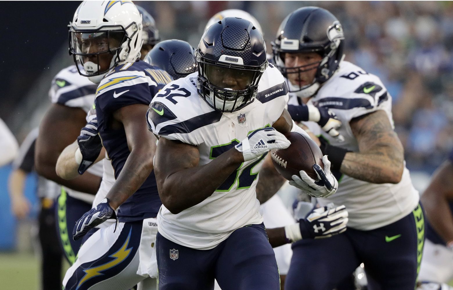 Seattle Seahawks quarterback Alex McGough (5) scrambles with the