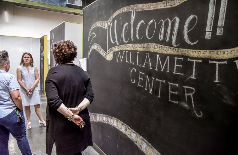 Multnomah County Chair Deborah Kafoury, center left, visits the county’s couples’ shelter recently. The shelter, where couples can share beds, is an innovation Kafoury instituted in her effort to get more of Portland’s homeless population inside. (Ben Brink / Special to The Seattle Times)