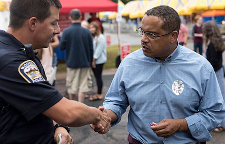 Keith Ellison, who is running for attorney general, campaigns at Woodbury Days in Woodbury, Minn., Aug. 24, 2018. Karen Monahan, a former girlfriend, has accused Ellison of emotional abuse, an allegation he has denied. (Tim Gruber/The New York Times)