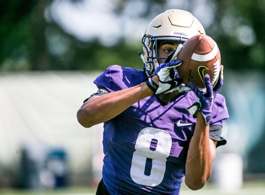 Wide receiver Marquis Spiker runs a drill during football practice at Husky Stadium, on August 6, 2018. (Rebekah Welch/The Seattle Times)