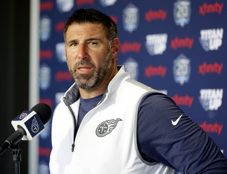 Tennessee Titans coach Mike Vrabel walks out of Friday's press conference