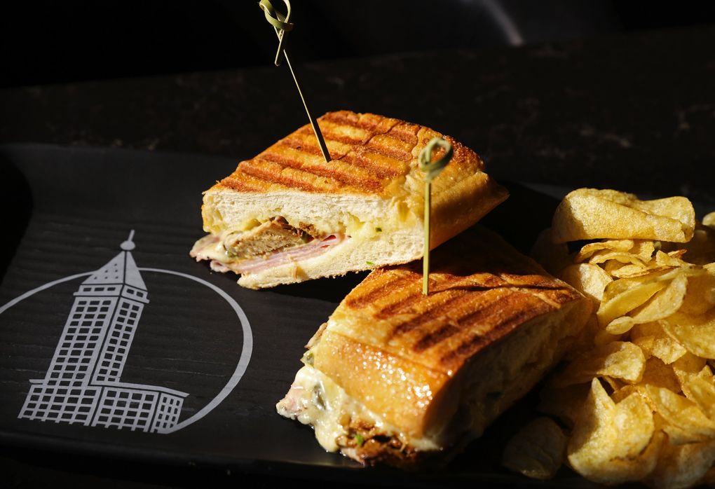 The pressed pork sandwich served at the Smith Tower Observatory bar and lounge. (Ken Lambert / The Seattle Times)