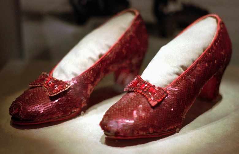 FILE – This April 10, 1996, file photo shows one of the four pairs of ruby slippers worn by Judy Garland in the 1939 film “The Wizard of Oz” on display during a media tour of the “America’s Smithsonian” traveling exhibition in Kansas City, Mo. Federal authorities say they have recovered a pair of ruby slippers worn by Garland that were stolen from the Judy Garland Museum in Grand Rapids, Minn., in August 2005 when someone went through a window and broke into the small display case. The shoes were insured for $1 million. (AP Photo/Ed Zurga, File) CER101 CER101