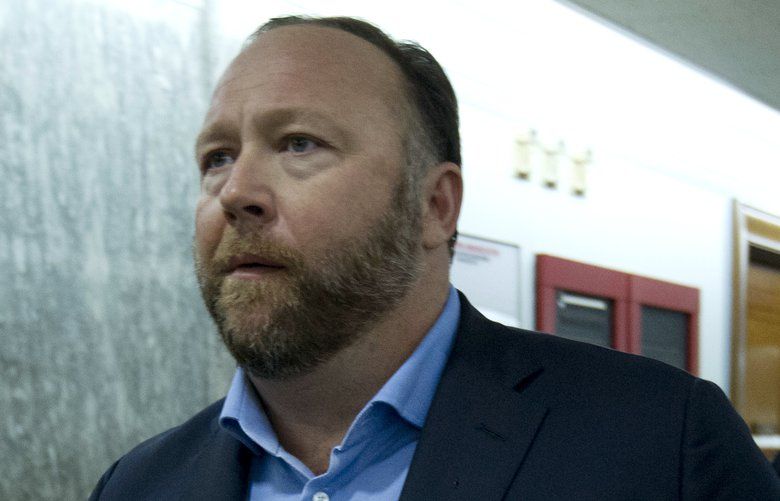 Alex Jones, the right-wing conspiracy theorist, walks the corridors of Capitol Hill after listening to Facebook COO Sheryl Sandberg and Twitter CEO Jack Dorsey testify before the Senate Intelligence Committee on ‘Foreign Influence Operations and Their Use of Social Media Platforms’ on Capitol Hill, Wednesday, Sept. 5, 2018, in Washington. (AP Photo/Jose Luis Magana) DCJL117 DCJL117