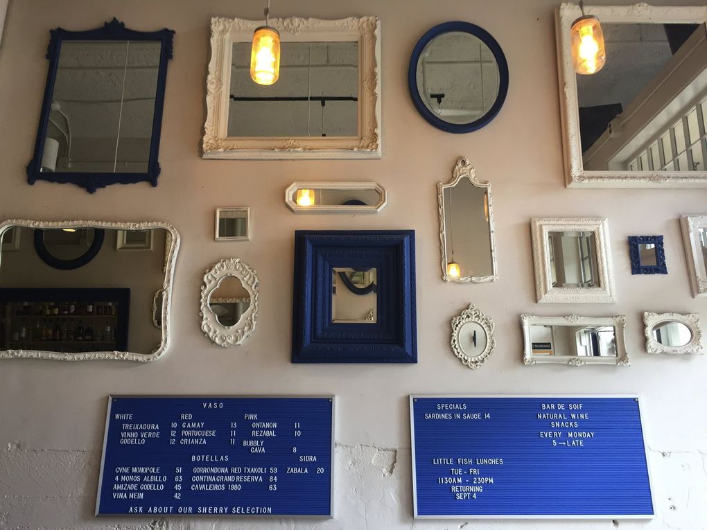 Mirrors framed in blue and white add a little nautical-feeling charm to the already amply charming, tiny little space. (Bethany Jean Clement / The Seattle Times)