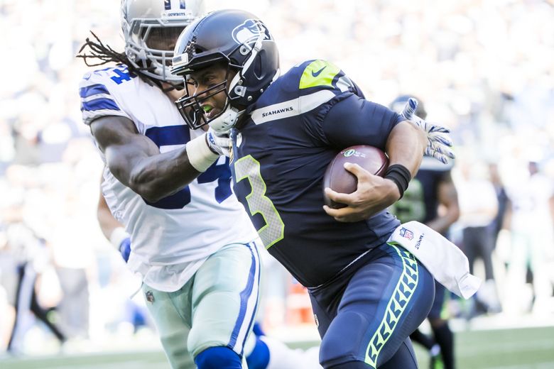 Running back Curt Warner of the Seattle Seahawks rushes for yards