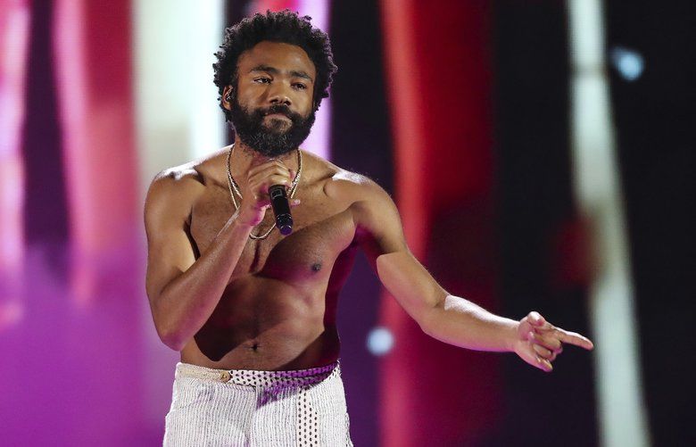 FILE – In this Friday, Sept. 21, 2018 file photo, Childish Gambino performs at the 2018 iHeartRadio Music Festival Day 1 held at T-Mobile Arena in Las Vegas. Childish Gambino is postponing his tour to recover after he injured his foot. Live Nation says the performer’s “This Is America Tour” will resume on Dec. 2 in Nashville. (Photo by John Salangsang/Invision/AP, File) CAET814 CAET814