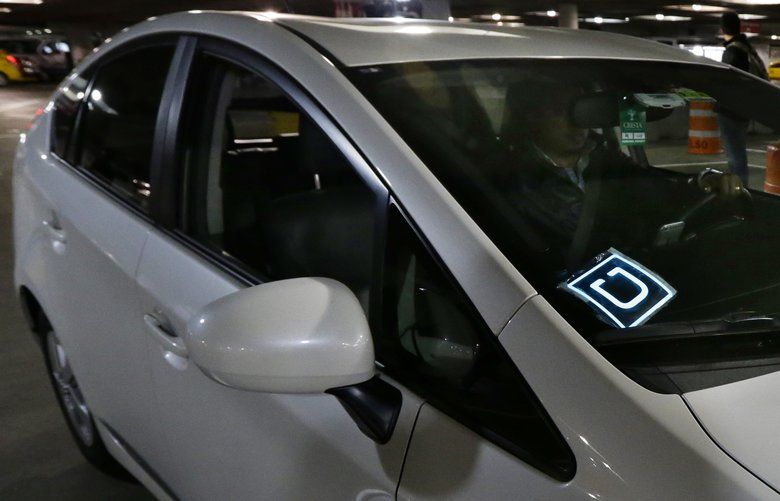 File- This March 31, 2016, file photo shows a driver for Uber Technologies Inc., arriving at an authorized customer pick up area at Seattle-Tacoma International Airport in Seattle. Uber will start keeping a closer eye on its drivers by tracking their speed and sudden acceleration or braking using data from the GPS and other motion sensors in their smartphones. The tests are new for Uber, which is eager to show that itâ€™s making safety a priority, at a time when authorities want to impose stricter rules on its hiring and operations. (AP Photo/Ted S. Warren/File)