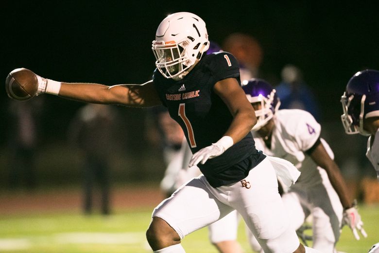 Eastside Catholic's Sam Adams II isn't much into playing defense or on the  line like the rest of his family