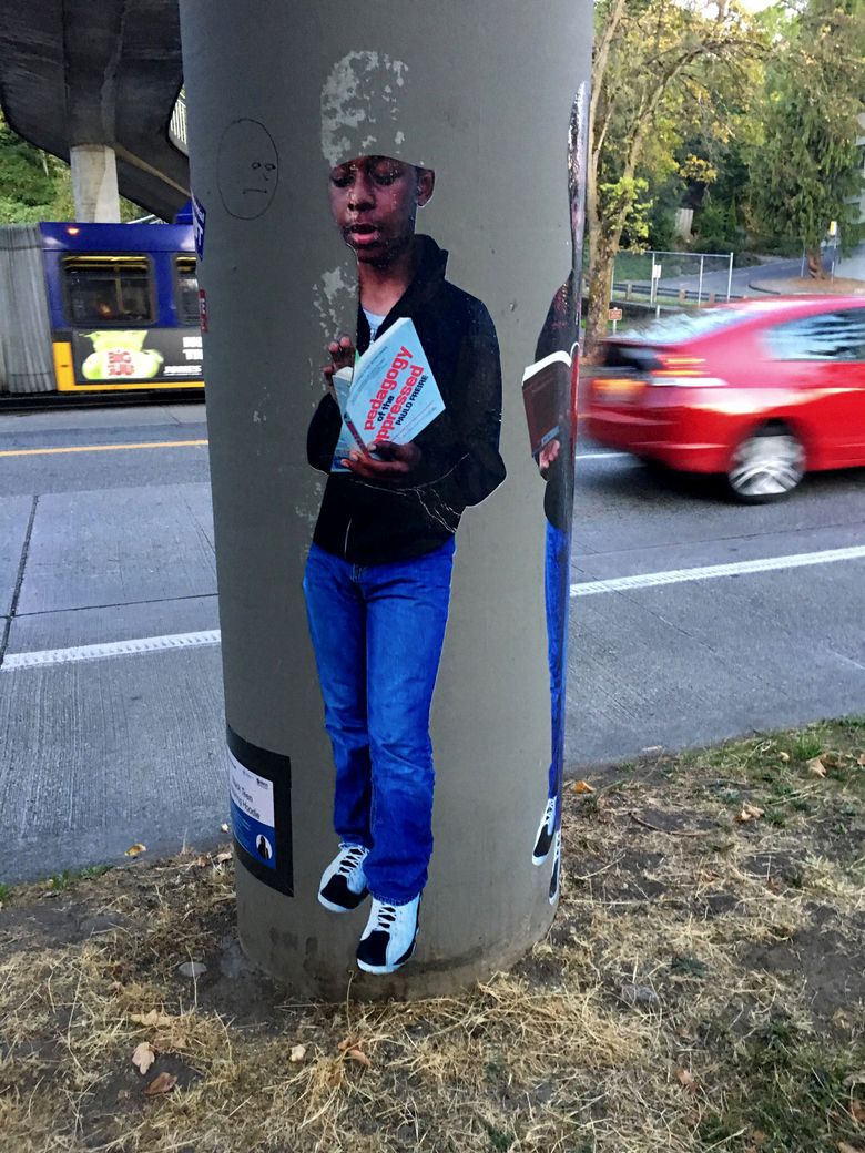 Jasmine Iona Brown is an artist whose work was vandalized this summer both in Capitol Hill and West Seattle. The photo decals, designed to be adhered to walls and posts, are of her son Jaymin Brown, 14.  (Jasmine Iona Brown)