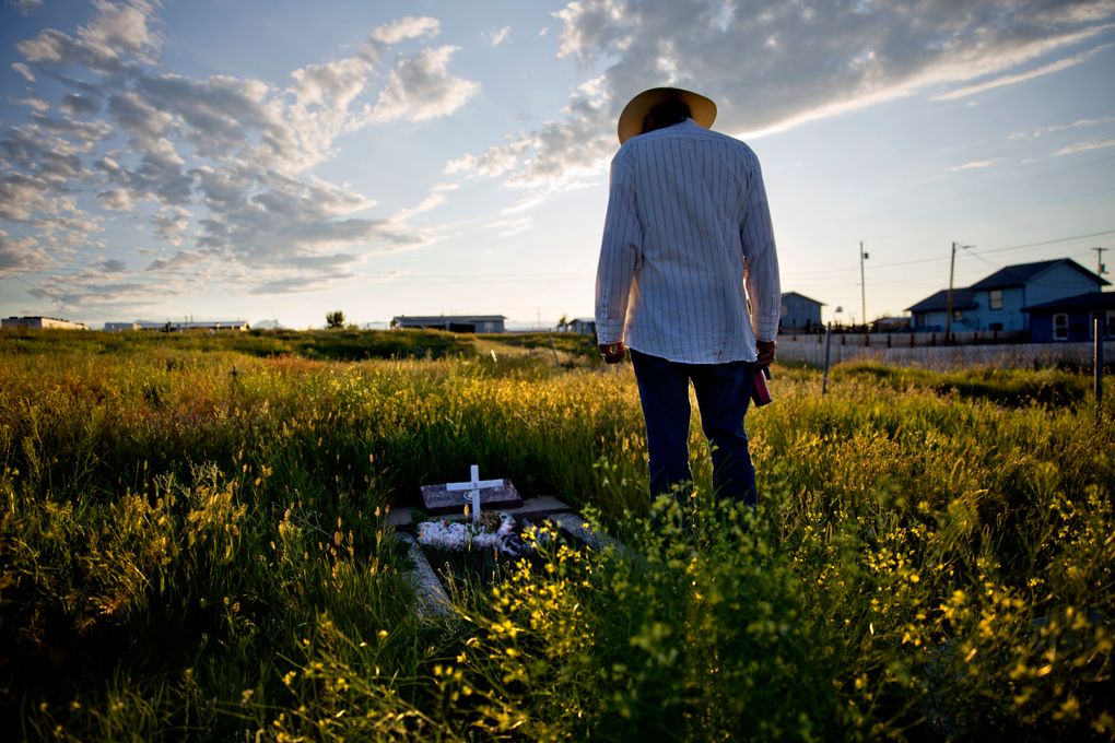 Kenny Still Smoking stands over the tombstone of his 7-year-old daughter, Monica, who disappeared from school in 1979 and found frozen on a mountain. “I talk to her, let her know I’m doing OK, that I’m still kicking,” he said. “I think about her all the time.” (David Goldman/AP)