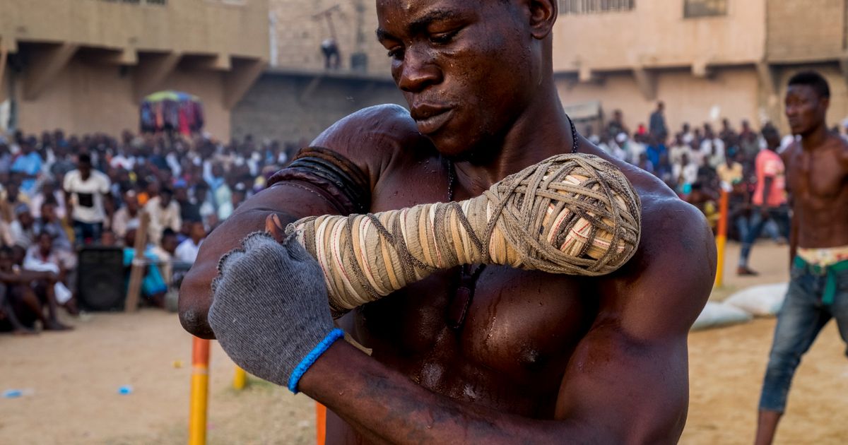 These boxers fight with cords wrapped around their fists and crowds ...