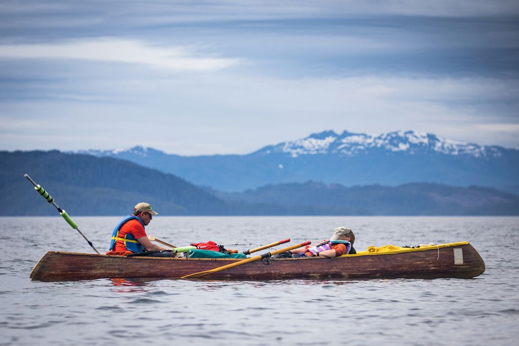 Alan Dappen, left, prepares a fishing pole while his brother, Andy, takes a short nap on the 2017 Inside Passage canoe trip. Alan has always been the more serious fisherman. (Nate Dappen)
