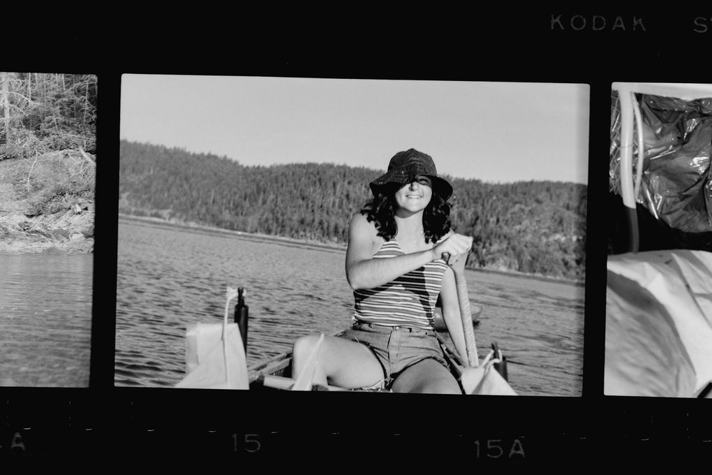 Sara Scherr paddles during a rare sunny day on the 1974 canoe trip up the Inside Passage. (Courtesy Nate Dappen)