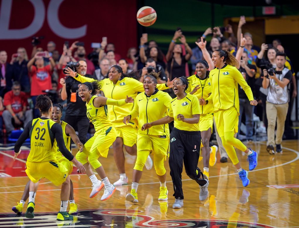 The Seattle Storm celebrate after sweeping the Washington Mystics for the franchise’s third WNBA Finals title. (Washington Post photo by John McDonnell).