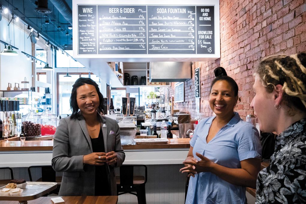 Laura Clise, left, founder and CEO of Intentionalist, talks with Lillian Hill, founder of Brown Sugar Baking Company, during the event series “Meet me at Cone & Steiner” in downtown Seattle before the pandemic. (Erika Schultz/The Seattle Times)