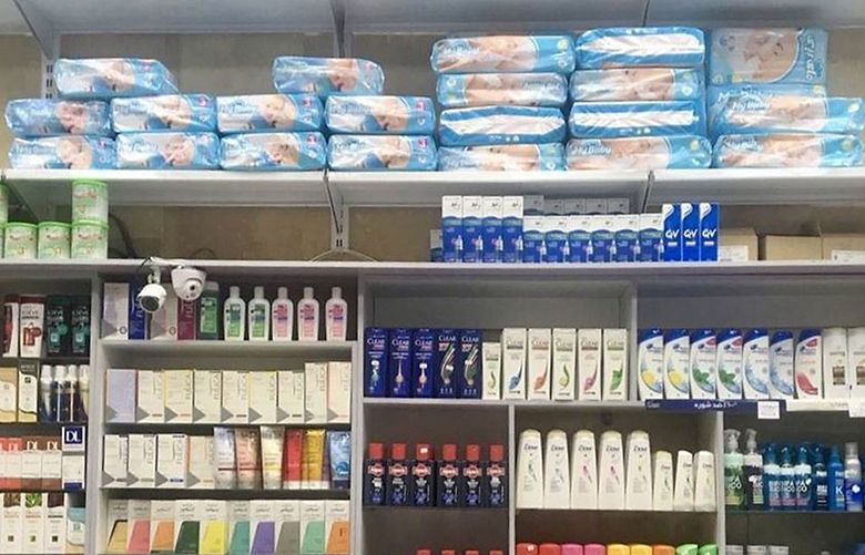 Packages of diapers lie on the top shelf of a pharmacy in western Tehran. Prices for the rare commodity have skyrocketed. (Ramin Mostaghim/Los Angeles Times/TNS)