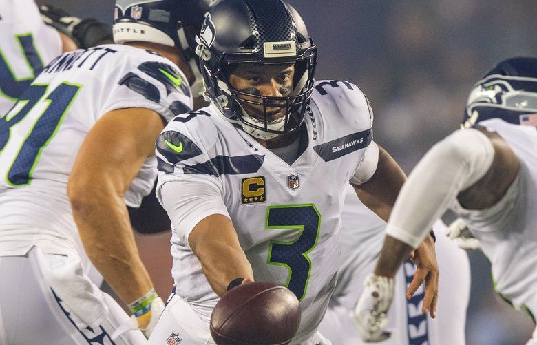 Seattle Seahawks quarterback Russell Wilson (3) hands off to Chris Carson during 2nd quarter action as the Chicago Bears play the Seattle Seahawks at Soldier Field in Chicago on September 17, 2018. 207697