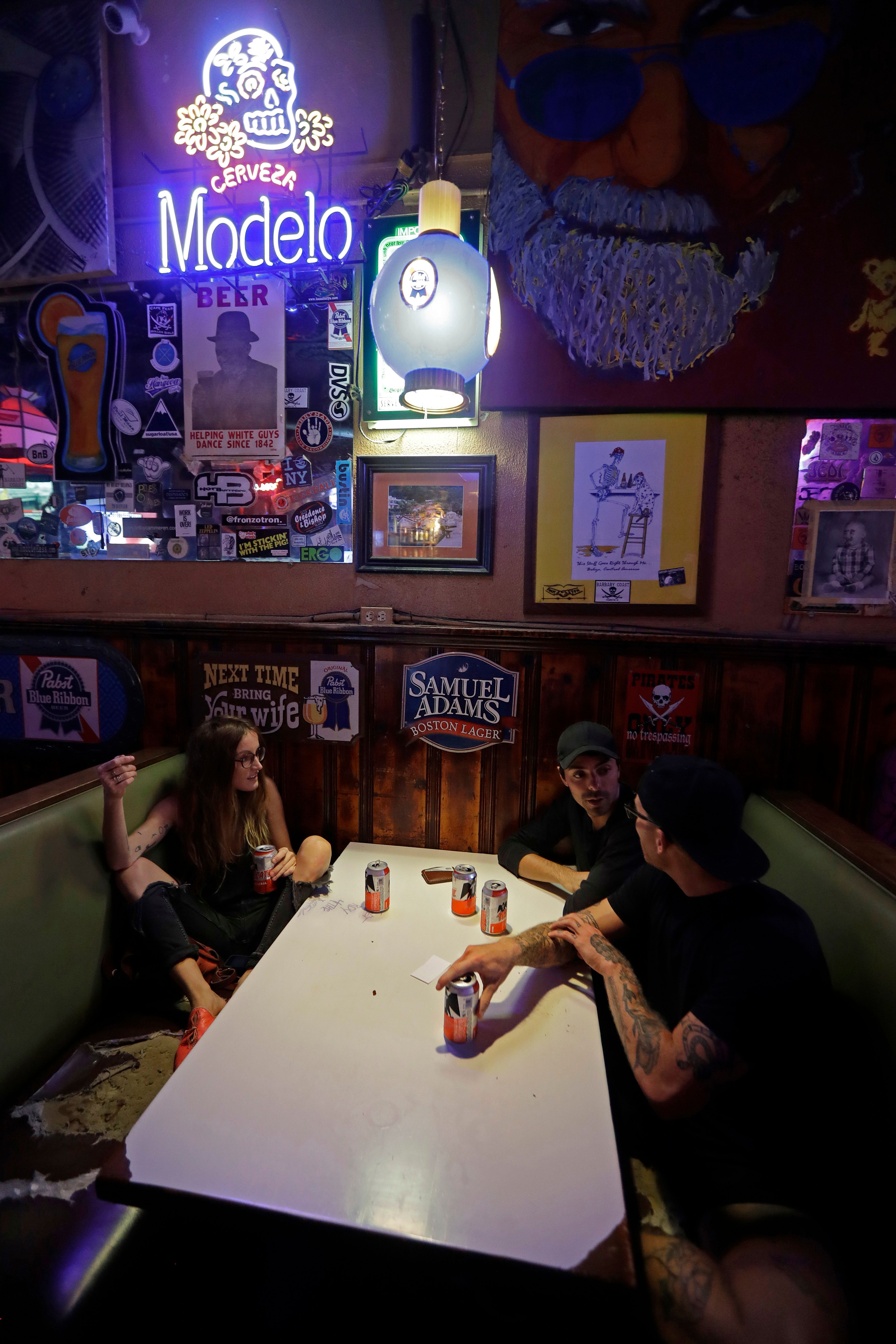 As hurricane blows, dive bar toasts