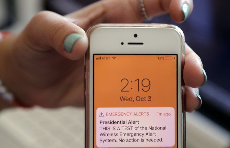 An alert on a cellphone as electronic devices sounded off across the United States, Wednesday, Oct. 3, 2018, as the Federal Emergency Management agency conducted an emergency alert test. (AP Photo/Lynne Sladky) 