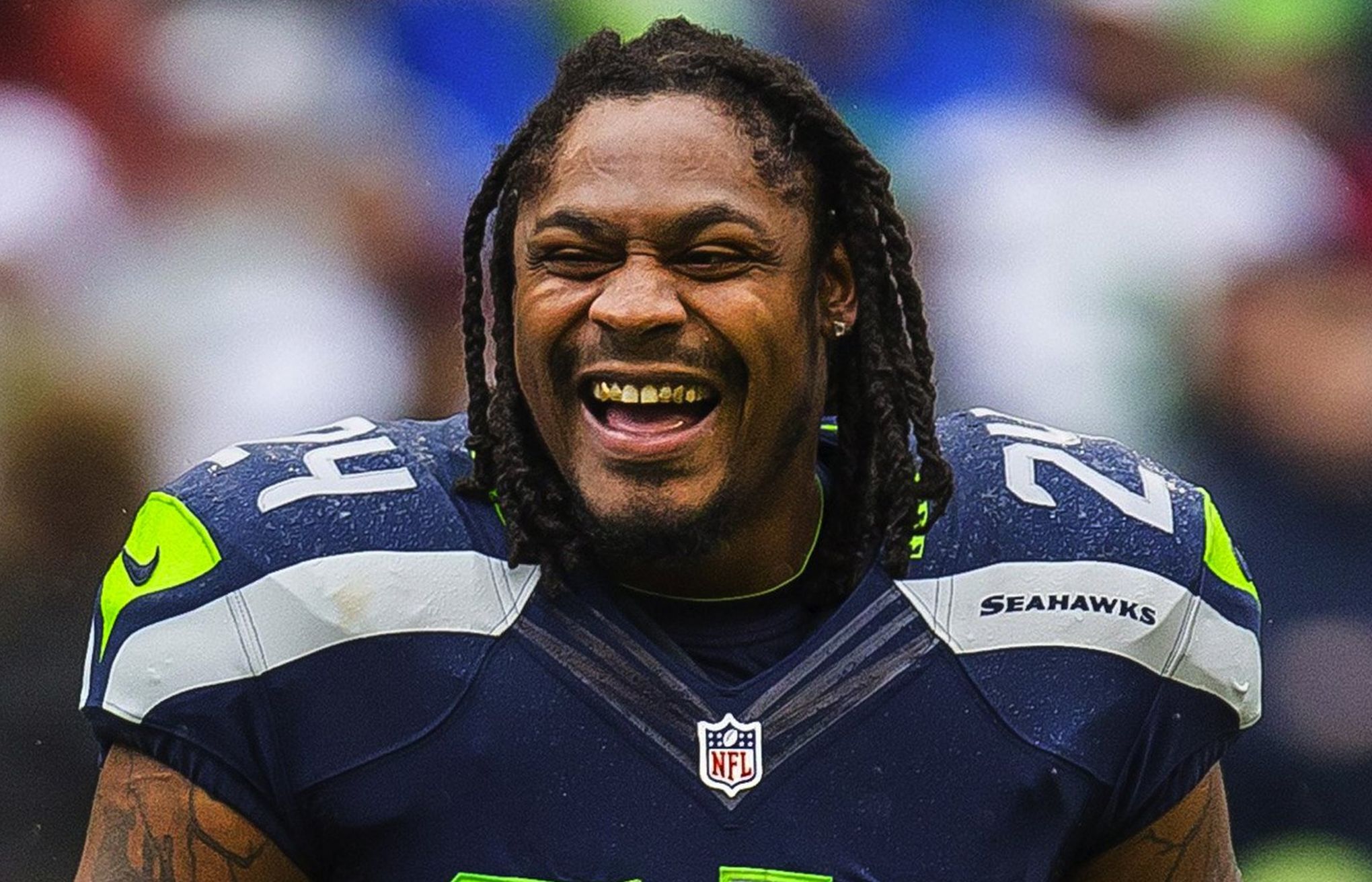 Seattle Seahawks running back Marshawn Lynch (24) dons his gloves during an  injury time out during the NFL Championship Game against the San Francisco  49ers at CenturyLink Field in Seattle, Washington on