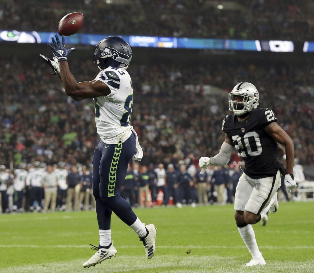 David Moore (83) catches one of the four TDs he’s hauled in over the last three games. (AP Photo/Tim Ireland)