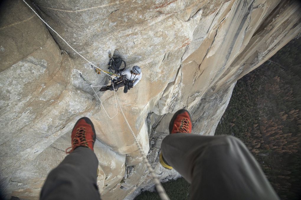 Jimmy Chin dangles on a rope above Cheyne Lempe as they wait for Alex Honnold to reach them. They’re positioned on Freerider on El Capitan in Yosemite National Park. (Jimmy Chin / National Geographic)