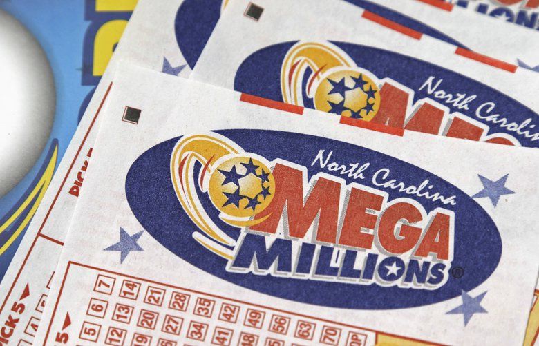 FILE – In this July 1, 2016, file photo, Mega Millions lottery tickets rest on a counter at a Pilot travel center near Burlington, N.C. A lucky player could soon overcome remarkably bad odds to win the ninth-largest lottery jackpot in U.S. history. Numbers will be drawn Friday night, Oct. 12, 2018 for a chance at the estimated $548 million Mega Millions prize. The jackpot has been growing since July, when a group of California office workers won $543 million. (AP Photo/Gerry Broome, File) NY112 NY112