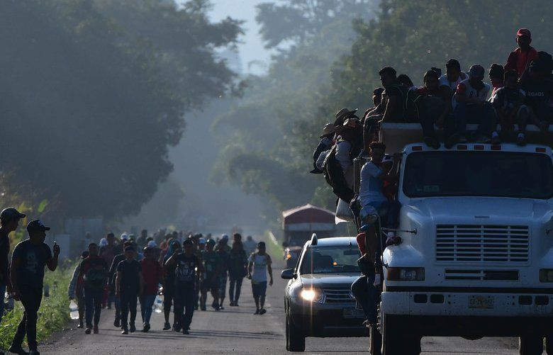 Thousands of Central American migrants continued their journey toward the U.S. border Thursday, Oct. 24, 2018, reaching the coastal town of Mapastepec, in Chiapas, Mexico. An estimated 7,200 migrants from Honduras and other countries have pressed on, sleeping on roads, traveling on rafts, going without food and water and facing police and threats from President Trump, who called them a “threat” and vowed to send troops to the border with Mexico. (Miguel Juarez Lugo/Zuma Press/TNS)  1243711 1243711