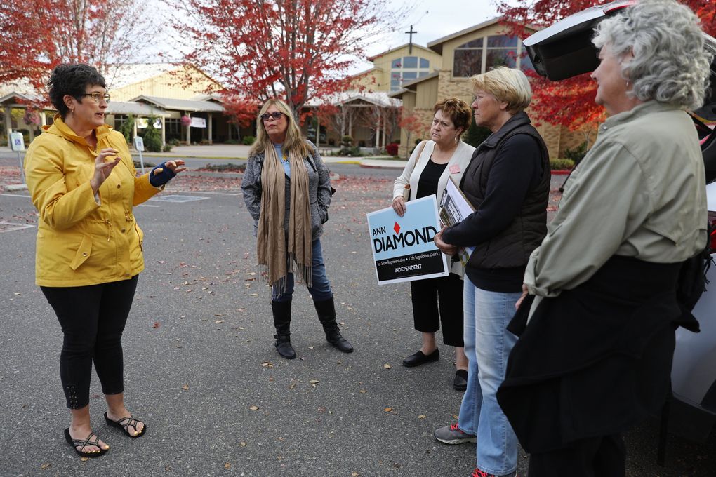 In Chelan County, Kelly Anderson leads a group of canvassers for candidates, including independent legislative hopeful Ann Diamond. From left: Anderson, Susan Whitehall, Suellen Harris, Jaime Krish and Beth Sattler. (Ken Lambert / The Seattle Times)