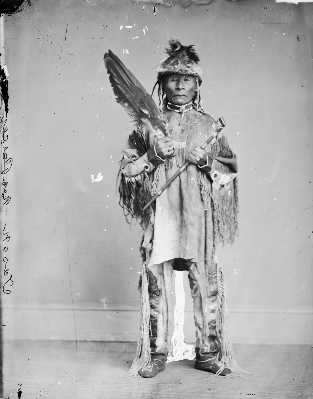 Chief Kalkalshuatash, of the Nez Perce, circa 1868, with ceremonial pipe and fan. (National Anthropological Archives, Smithsonian Institution)