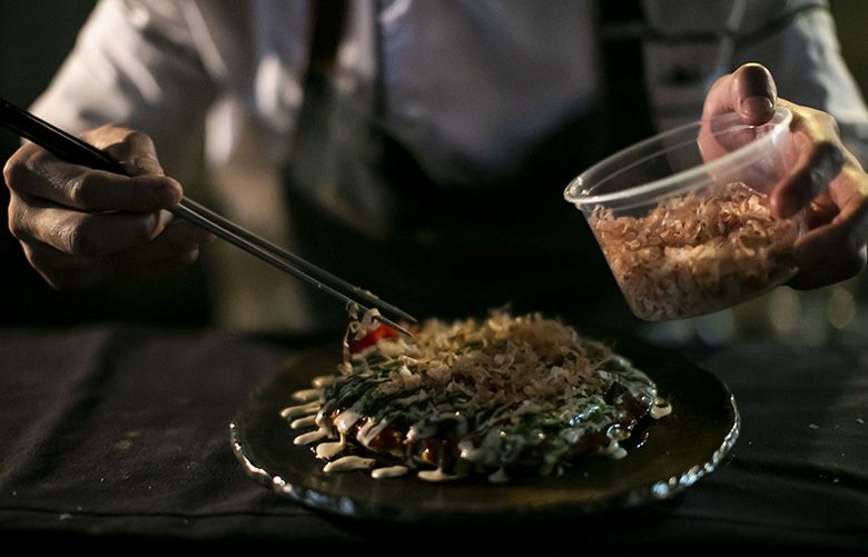 Kaz Nakasone, head chef at Kokkaku, prepares Okonomiyaki at Kokkaku in Wallingford Wednesday, Sept. 26, 2018.