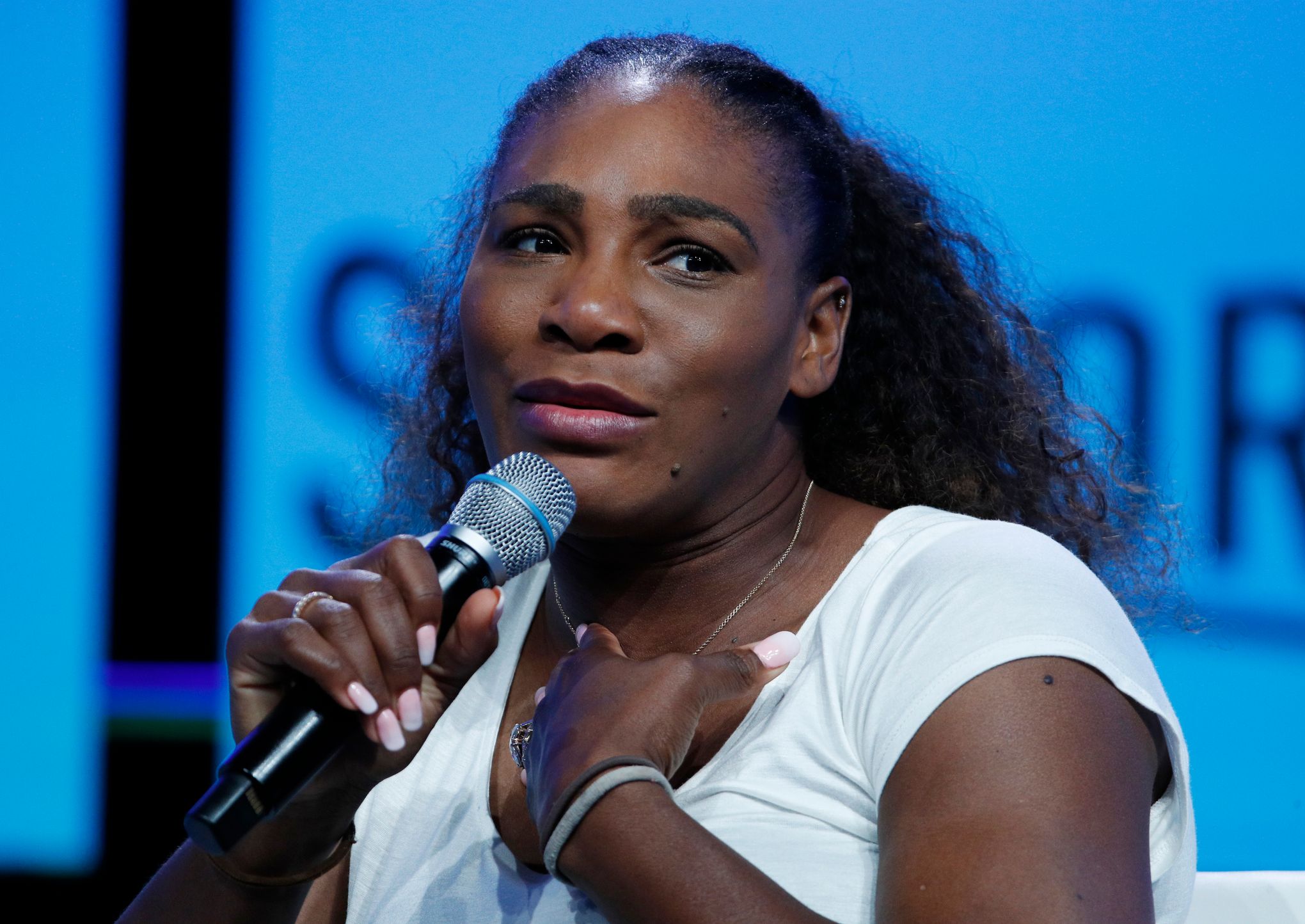 Serena Williams sings, goes topless for breast cancer video