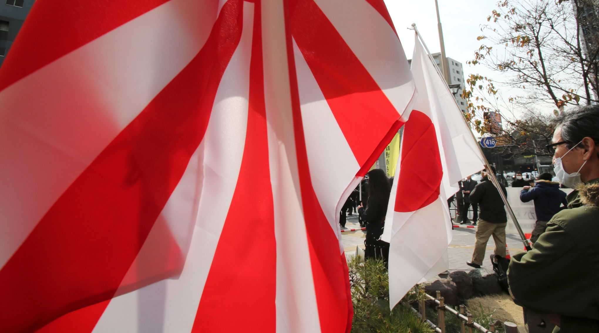 Japan to skip South Korea fleet event over 'rising sun' flag