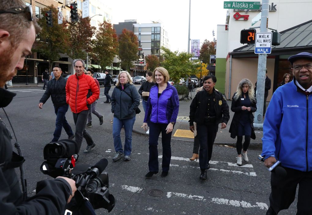 Seattle Mayor Jenny Durkan, who is coming up on a year in office, visited businesses and talked to constituents during a neighborhood tour in West Seattle, Monday, Nov. 12, 2018. Chief of Police Carmen Best, right, accompanied the mayor. (Ken Lambert / The Seattle Times)