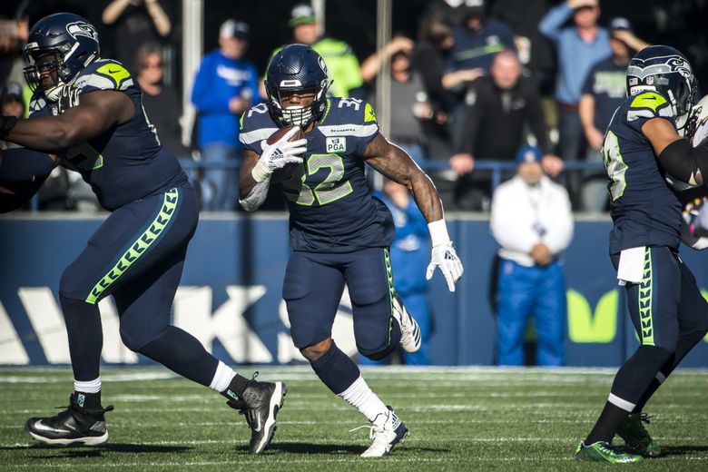 Seattle, United States. 3rd Oct, 2019. Seattle Seahawks running back Chris  Carson (32) catches the winning 5-yard touchdown pass against the Los  Angeles Rams at CenturyLink Field during the fourth quarter in