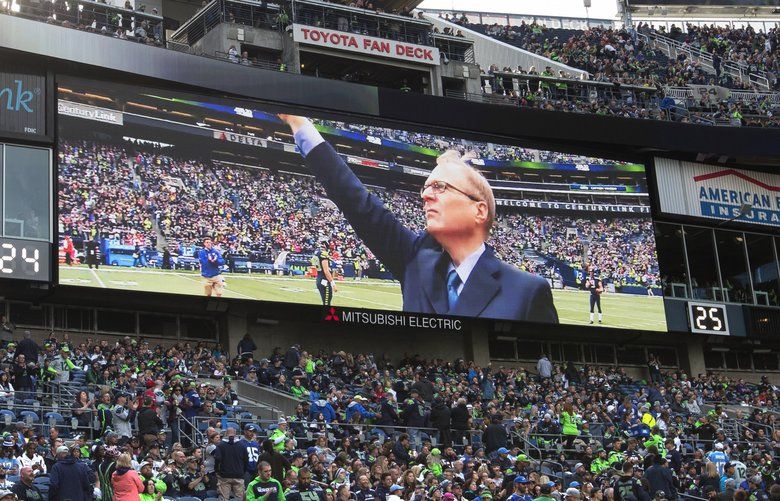 Seahawks honor Paul Allen with 12th Man flag raising at first home