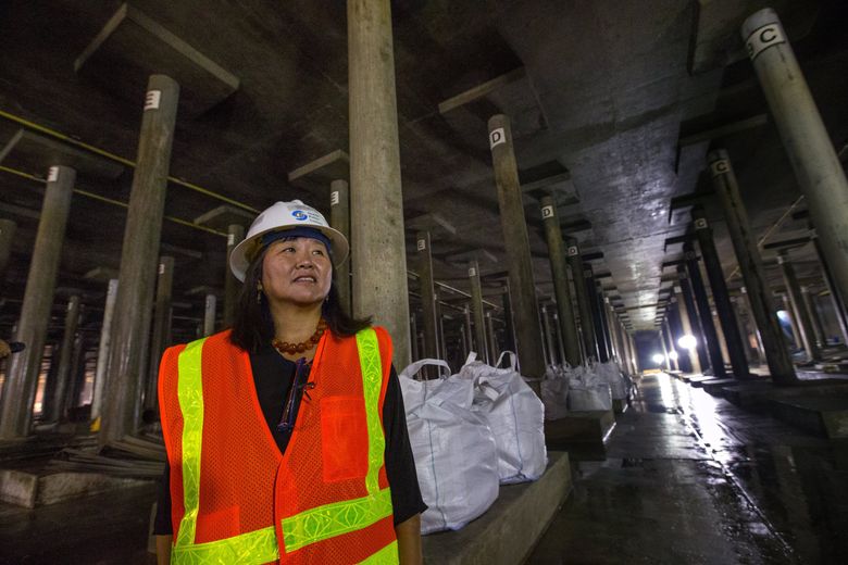 Mami Hara, CEO and general manager of Seattle Public Utilities, stands inside the Beacon Reservoir in August 2017, when the underground facility was being upgraded to withstand a major earthquake. The reservoir is the city’s largest, holding 50 million gallons of water. Its walls were strengthened and it was equipped with special valves to keep much of the water from leaking out if a quake ruptures connecting pipes.  (Ellen M. Banner / The Seattle Times)