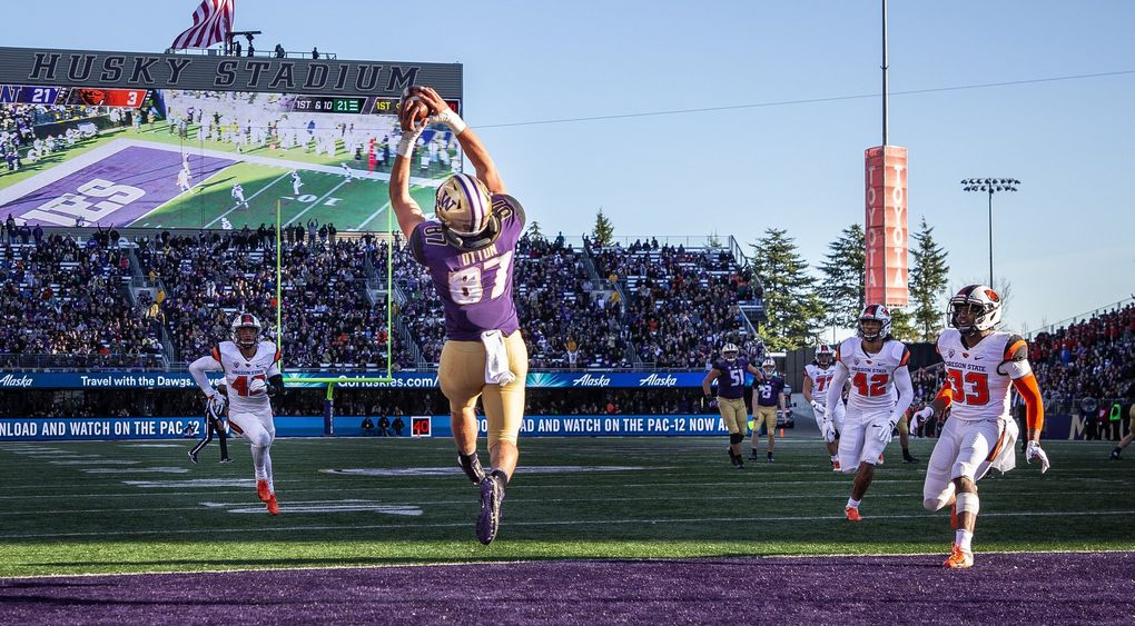 Washington’s Cade Otton catches a touchdown pass from Jake Browning. (Dean Rutz / The Seattle Times)