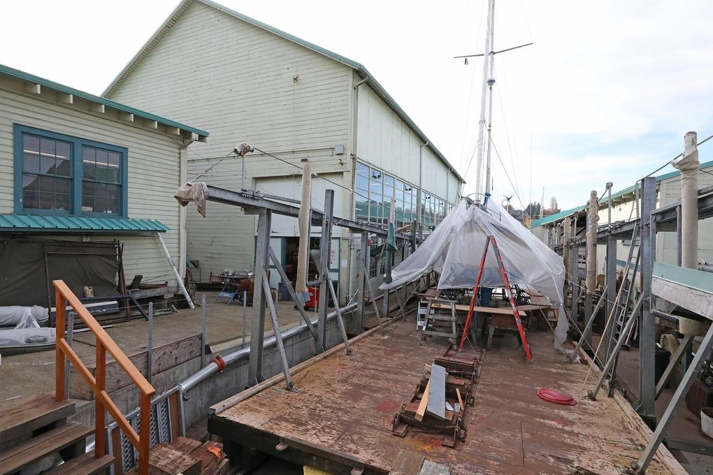 A sailboat is hauled out of the water on the large platform at right. The boat yard opened in 1927. (Greg Gilbert / The Seattle Times)