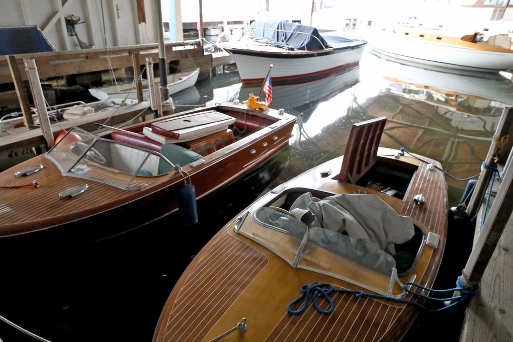 At Jensen Motor Boat on Portage Bay, two vintage, all-wood Chris Craft runabouts are stored in the foreground. (Greg Gilbert / The Seattle Times)