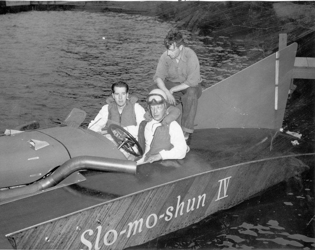 Stan Sayres sits at the wheel of his world record-holding speedboat, Slo-mo-shun IV in a photo circa 1950. With him are designer Ted Jones and builder Anchor Jensen. The Slo-mo saga is clouded by controversy about who, exactly, should get credit for inventing the fast boat, Jensen or Jones.
(The Associated Press)