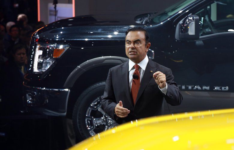FILE– Carlos Ghosn, chairman and chief executive of Renault and Nissan, reveals the line of Nissan Titan pickup trucks at the North American International Auto Show in Detroit, Jan. 12, 2015. Ghosn was arrested on Nov. 19, 2018, after an internal company investigation found that he had underreported his compensation to the Japanese financial authorities for several years. Nissan said it was cooperating with Japanese prosecutors. Both Ghosn and a director, Greg Kelly, who was also accused of misconduct, were taken in by authorities, the company said. (Fabrizio Costantini/The New York Times) XNYTF XNYTF